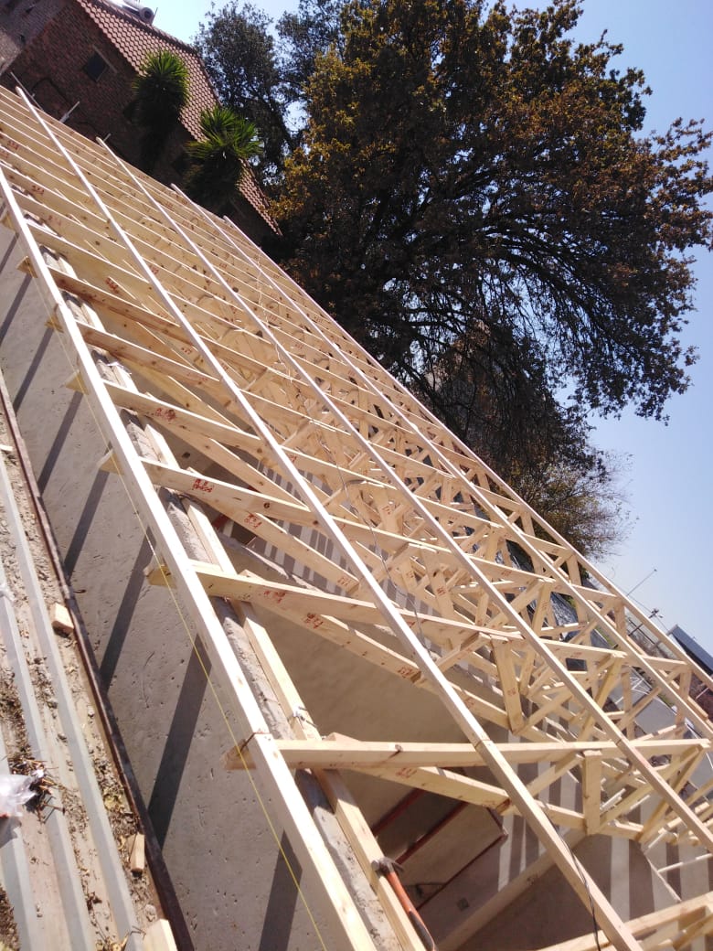 Timber roof trusses erected on concrete block walls